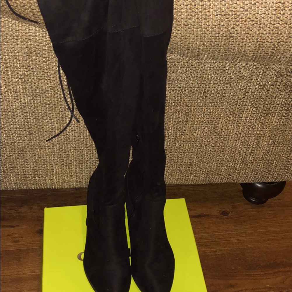 Thigh high black boots